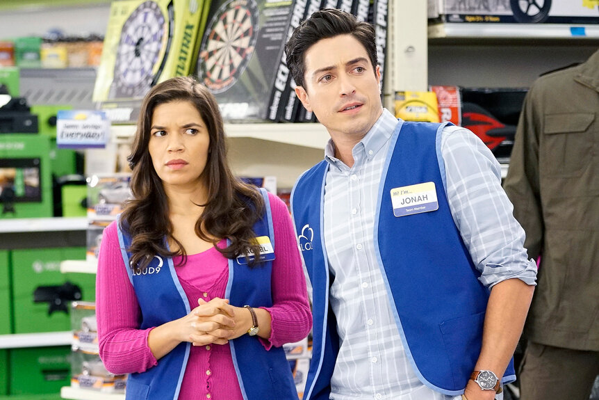 Amy (America Ferrera) and Jonah (Ben Feldman) wear matching blue vests in Superstore Episode 204.