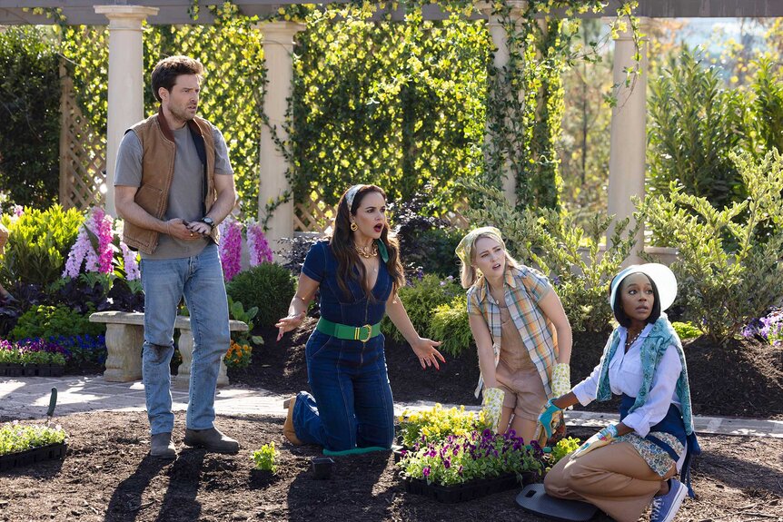 Brett, Birdie, Alice, and Catherine sitting on the garden floor in Grosse Pointe Garden Society Season 1, Episode 3.