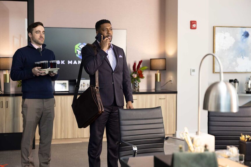 Brian and Tucker walking into a room in Grosse Pointe Garden Society Season 1, Episode 3.