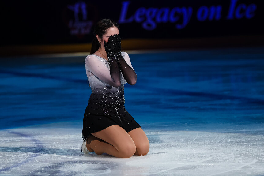 Isabella Aparicio cries into her hands on the ice during the Legacy On Ice U.S. Figure Skating Benefit