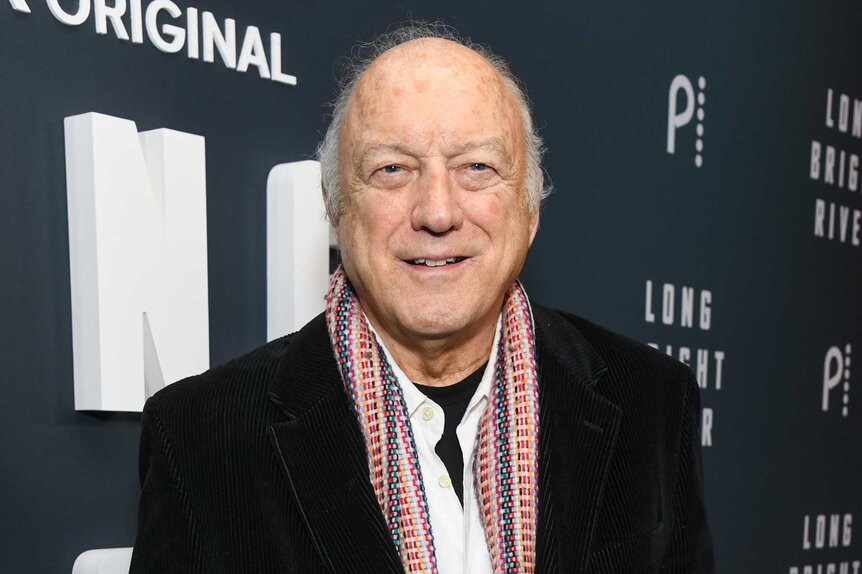 John Doman smiling and posing at the New York premiere of Long Bright River.