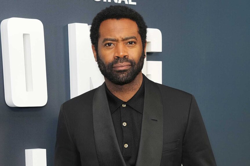 Nicholas Pinnock smiling and posing at the New York premiere of Long Bright River.