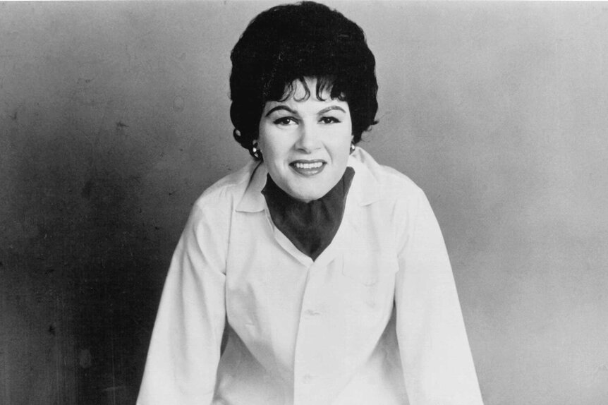 A close up of Patsy Cline smiling.