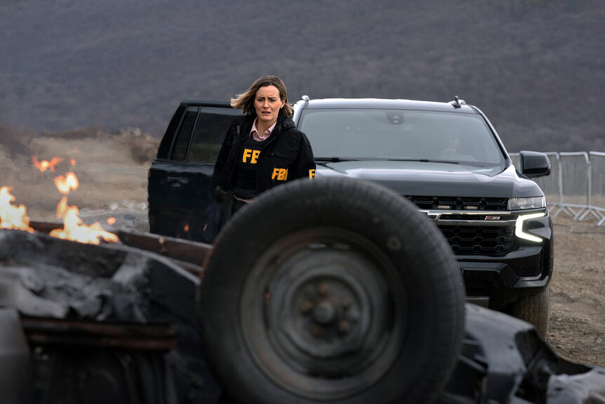 Taylor Schilling runs away from a truck on Poker Face Season 2