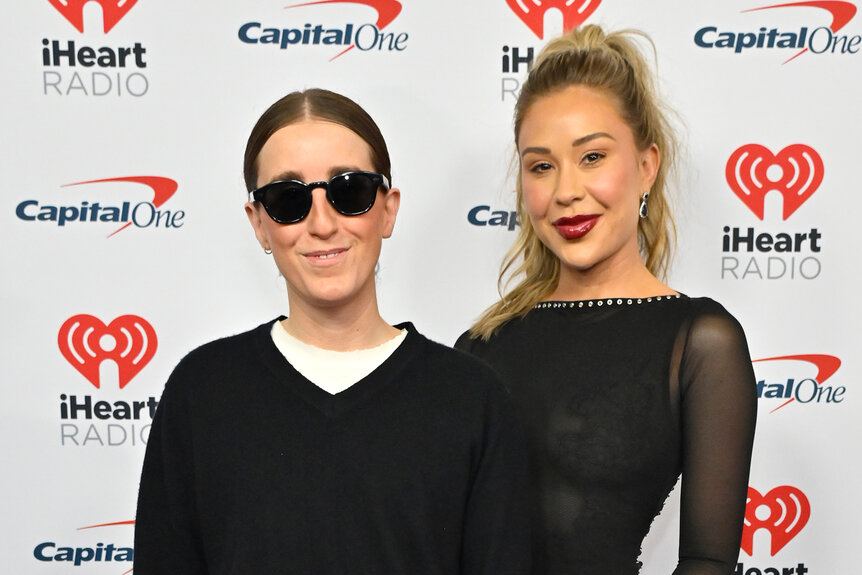 Robby Hoffman and Gabby Windey pose together ont he red carpet for the 2023 iHeartRadio Music Festival