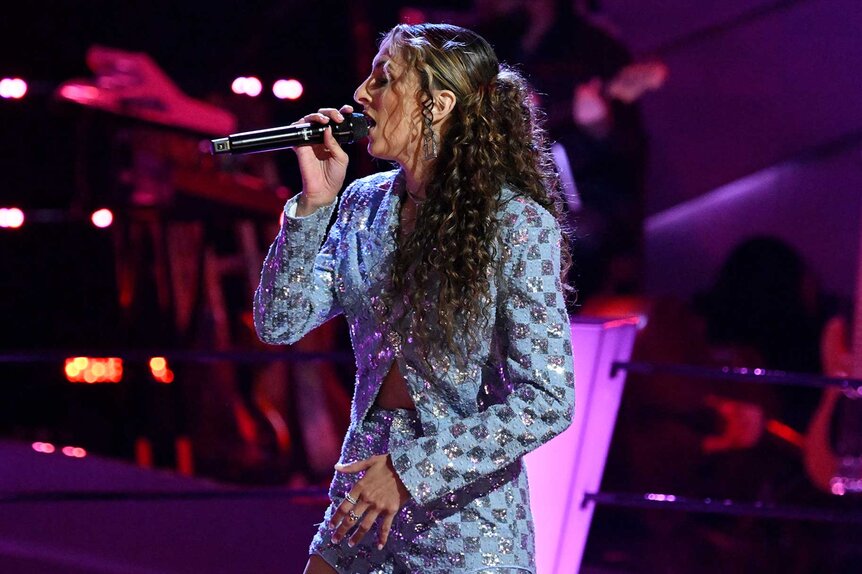 Angie Rey performing on stage on The Voice Season 27, Episode 6.