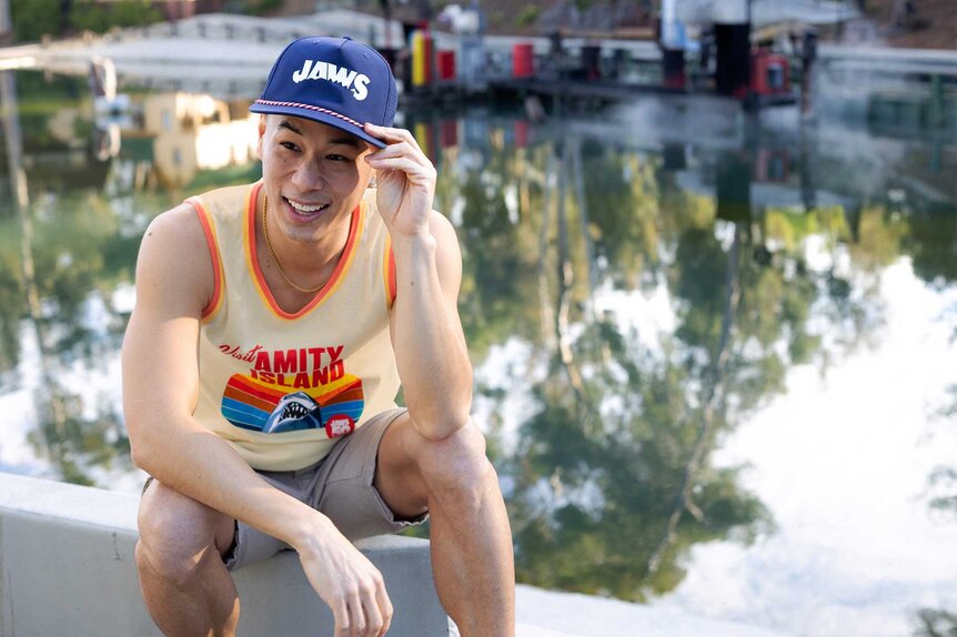 A model wearing a Jaws baseball cap for Universal Studios Jaws 50th Anniversary.